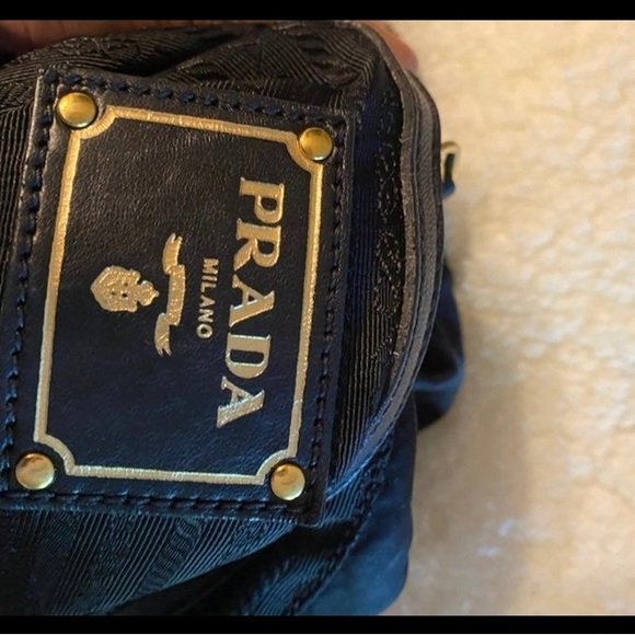 Authentic black Prada bag with draw string. One draw string came off. Clean - Picture 9 of 13